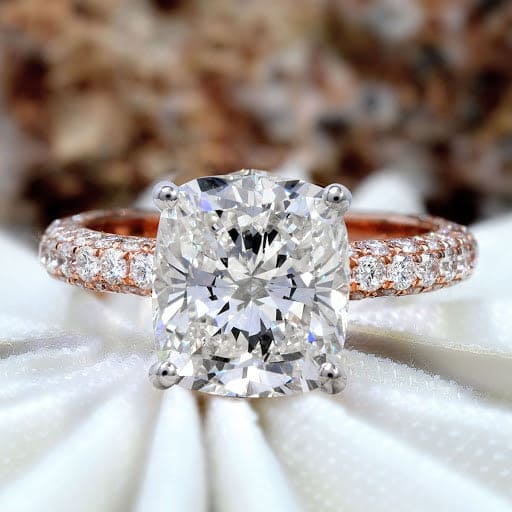 Cushion engagement ring with hidden halo rose