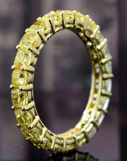 Cushion cut canary fancy yellow diamond eternity ring