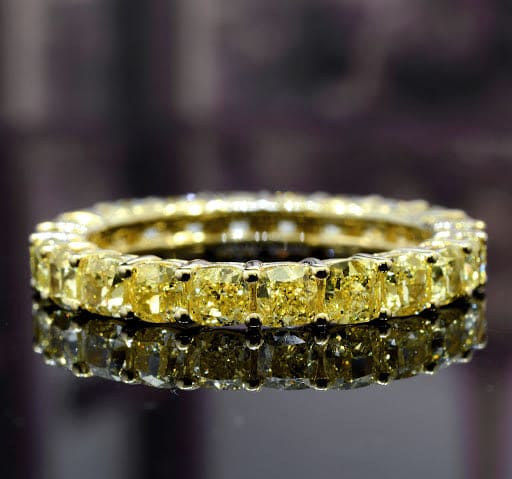 Cushion cut canary fancy yellow diamond eternity ring