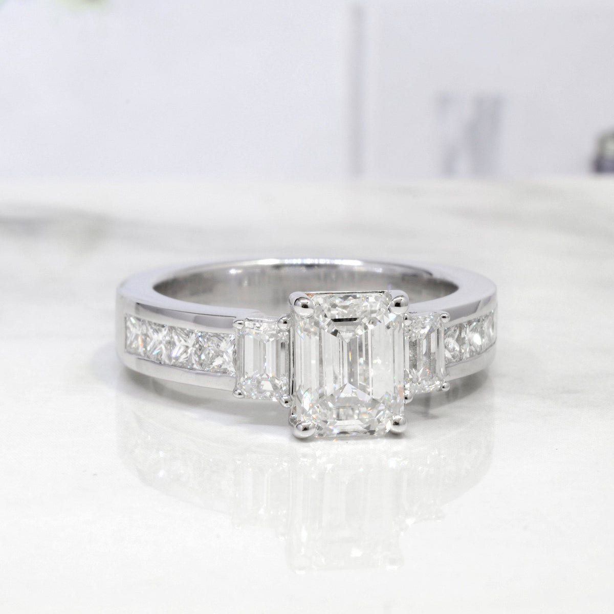  emerald cut 3stone diamond ring with accents