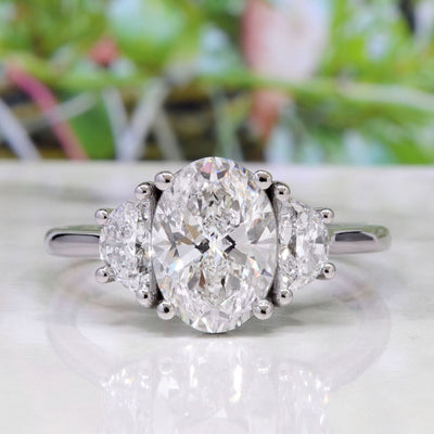 Oval Cut 3 Stone Diamond Ring with Half Moons