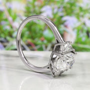 3 stone oval engagement ring with half moons Profile View