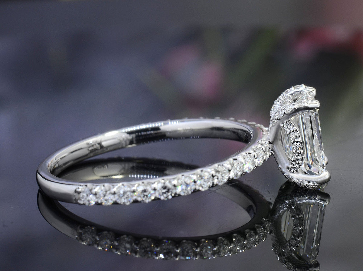 Hidden halo emerald cut engagement ring side view