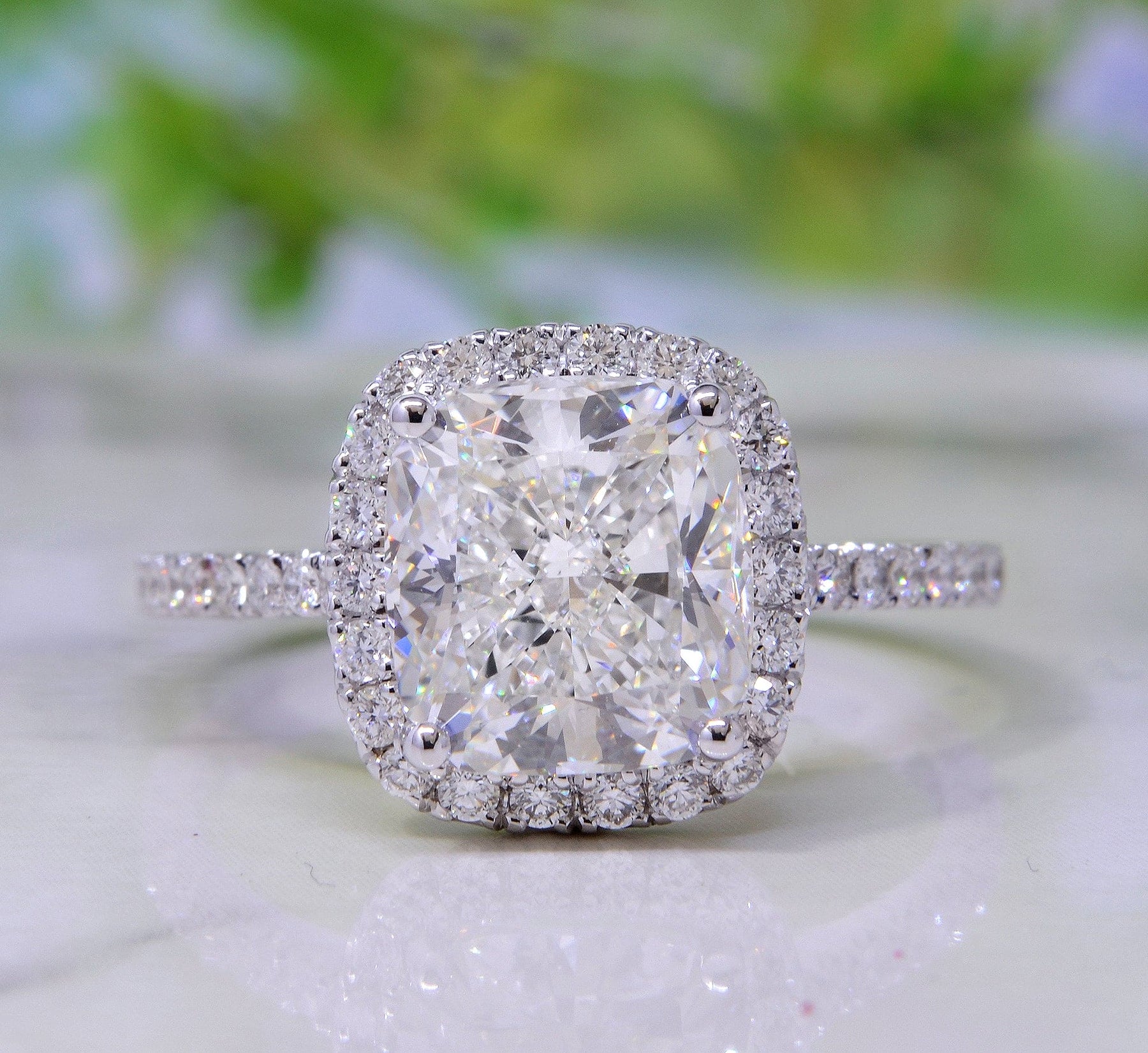 Single halo cushion cut engagement ring hotsell