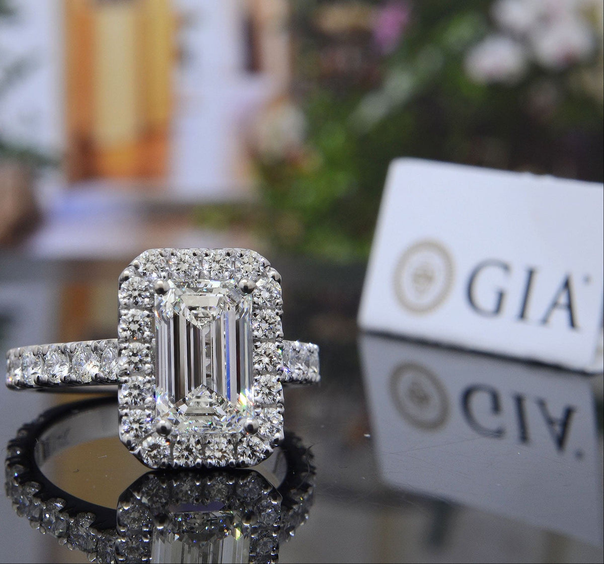 Emerald cut halo engagement ring