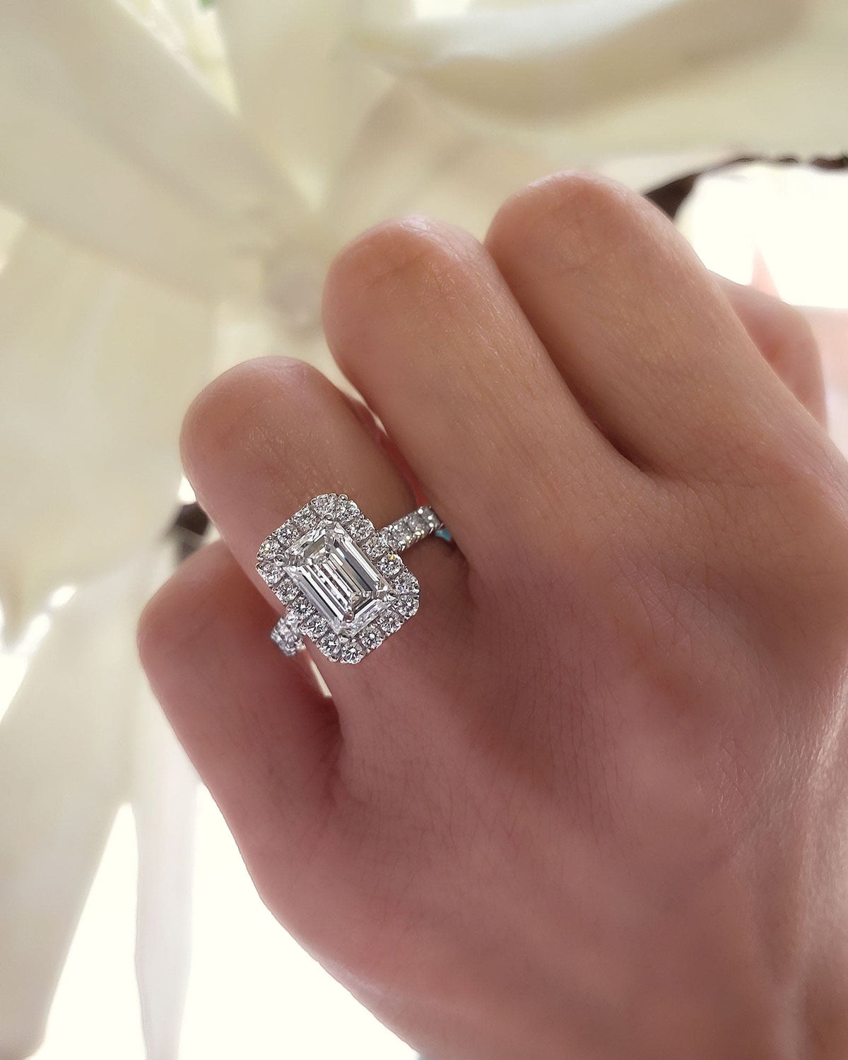 Halo emerald cut engagement ring
