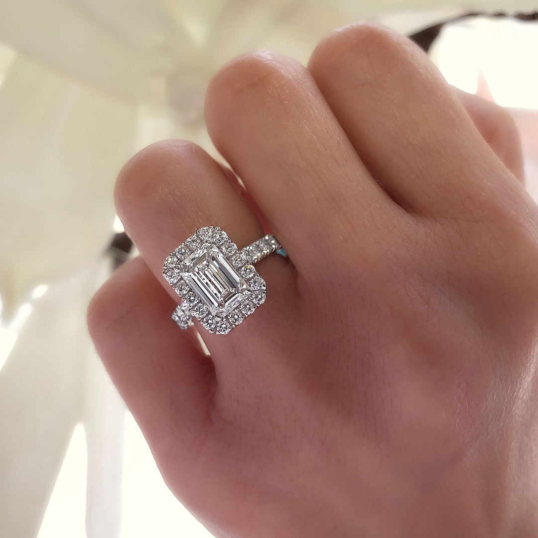 Emerald Cut Halo Engagement Ring on Hand white gold