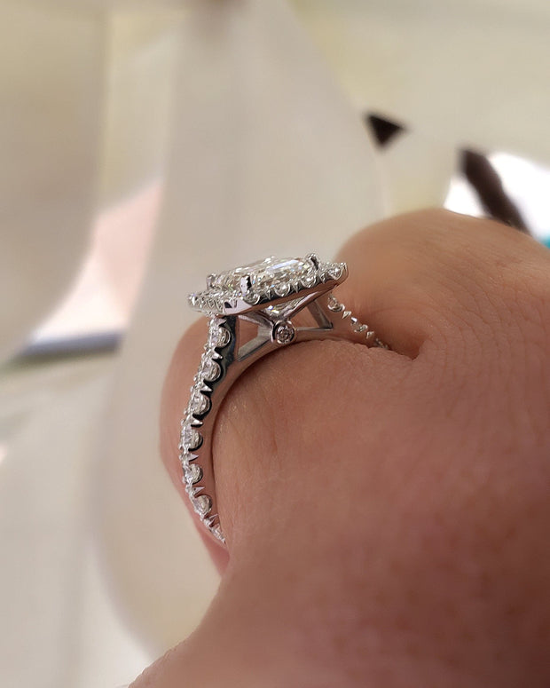  Emerald Cut Halo Engagement Ring on hand side view