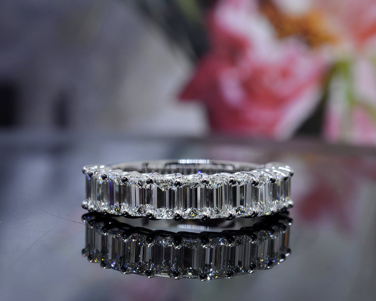 Half eternity emerald cut ring