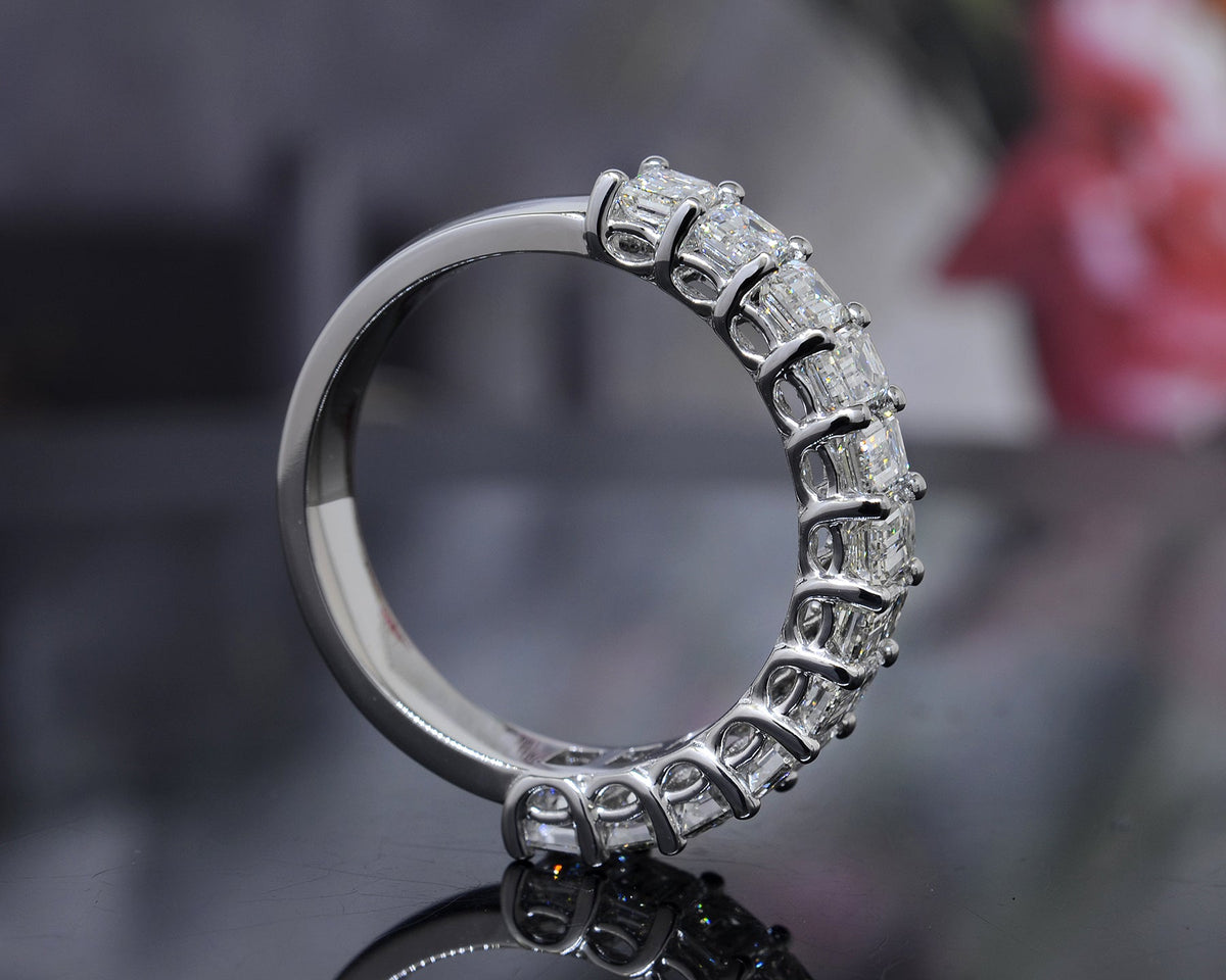 Half eternity emerald cut ring side profile
