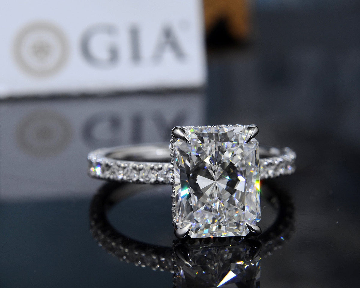 Hidden halo elongated radiant cut engagement ring