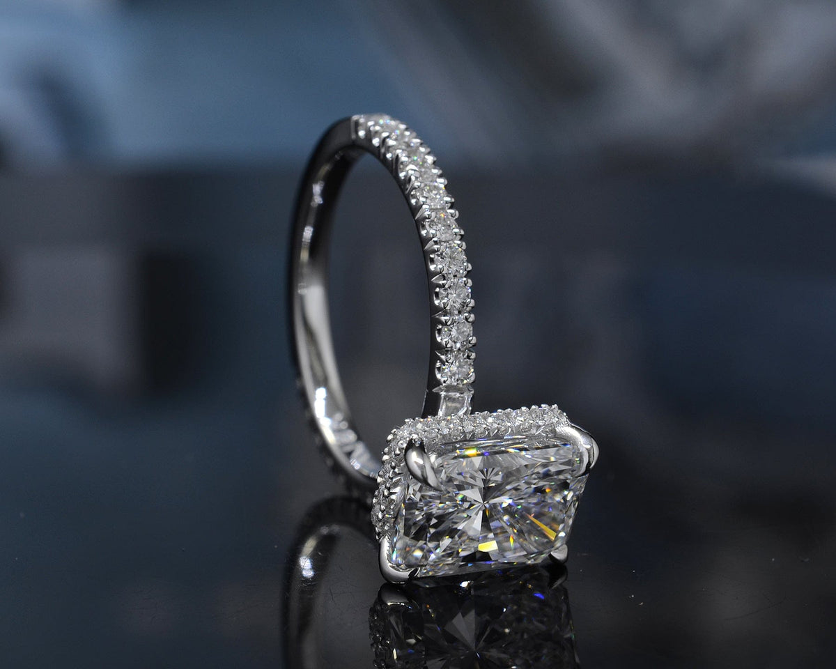 Hidden halo elongated radiant cut engagement ring side profile