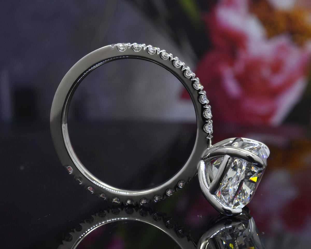 Cushion cut diamond ring with accent side profile