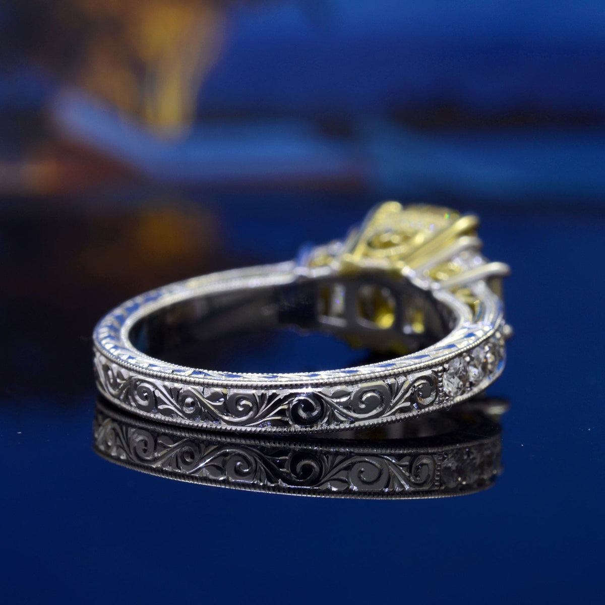 Yellow radiant diamond ring with trapezoids back view