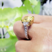 Elongated Yellow Radiant Engagement Ring on Finger
