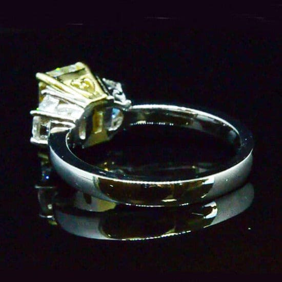 3 stone yellow emerald cut diamond ring