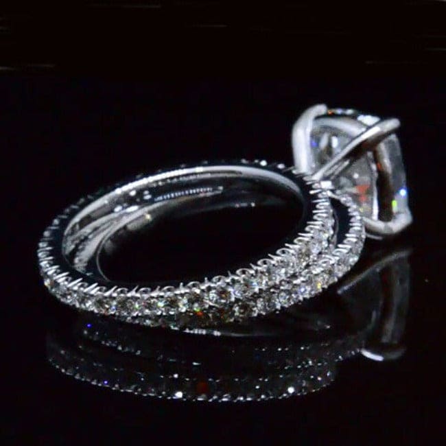 Cushion cut diamond eternity engagement ring and matching band 