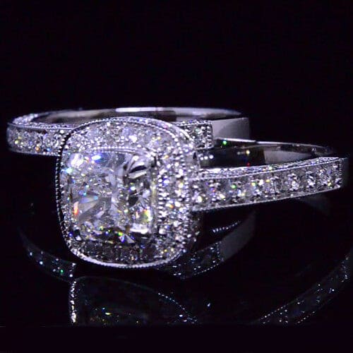 Cushion cut diamond halo engagement ring set