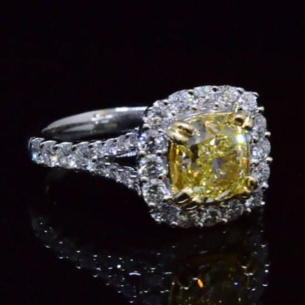 Fancy yellow diamond split shank engagement ring