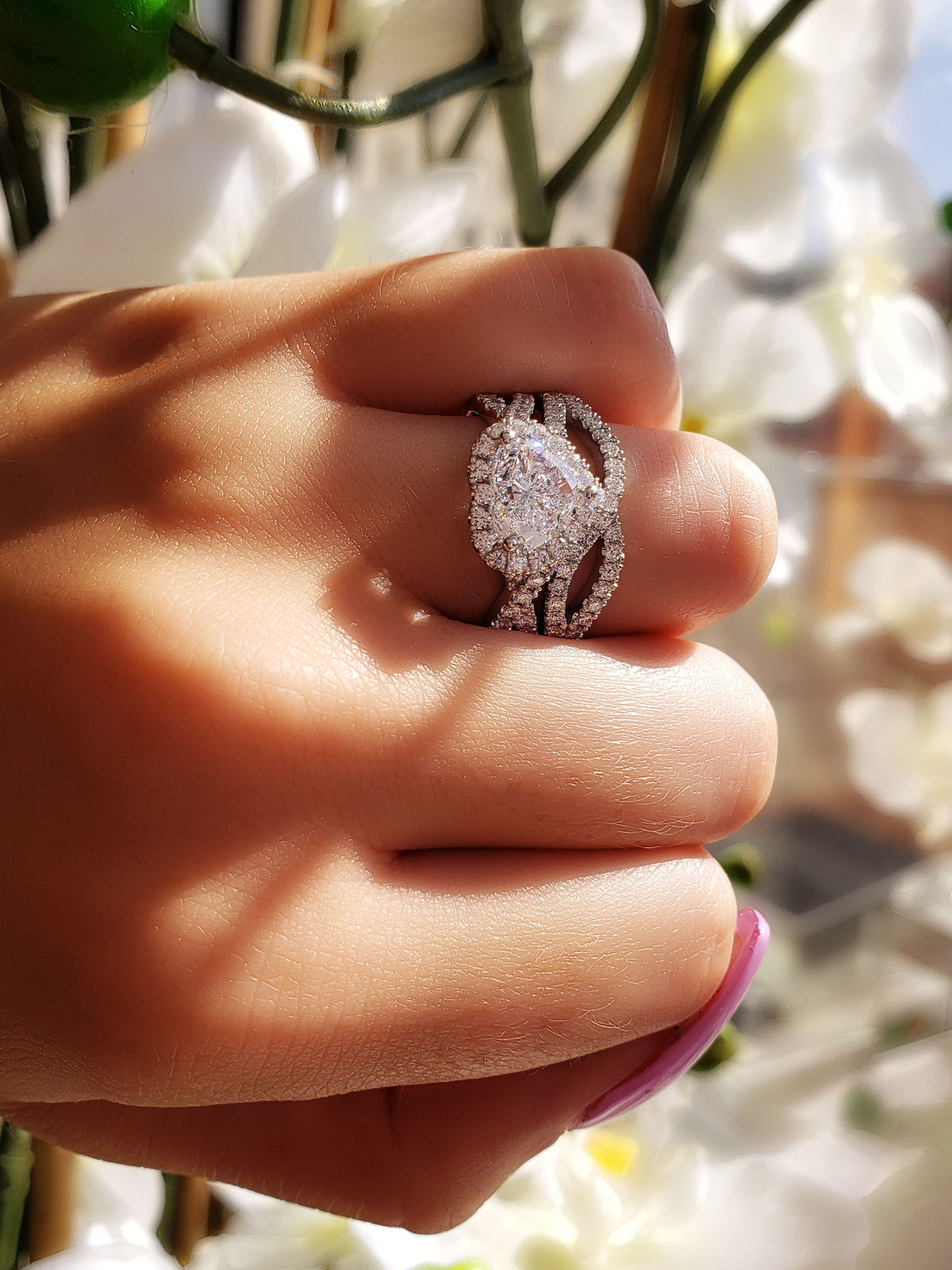Heart shape halo diamond engagement ring on hand