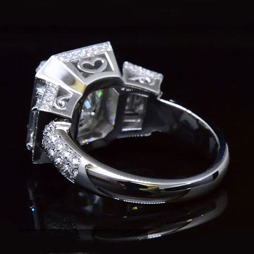 Halo cushion cut with trapezoid cut diamond ring side profile
