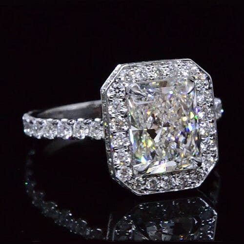 Halo radiant cut engagement ring with hidden halo
