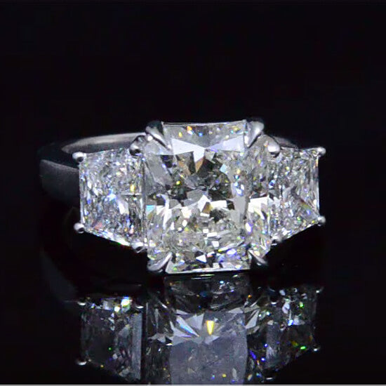 Radiant cut  3 stone trapezoid diamond engagement ring