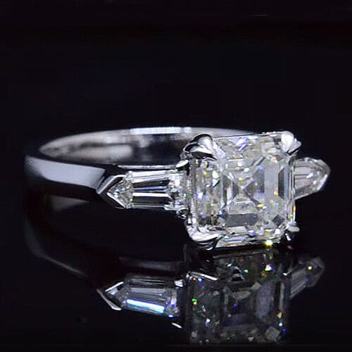 Three stone asscher cut diamond ring