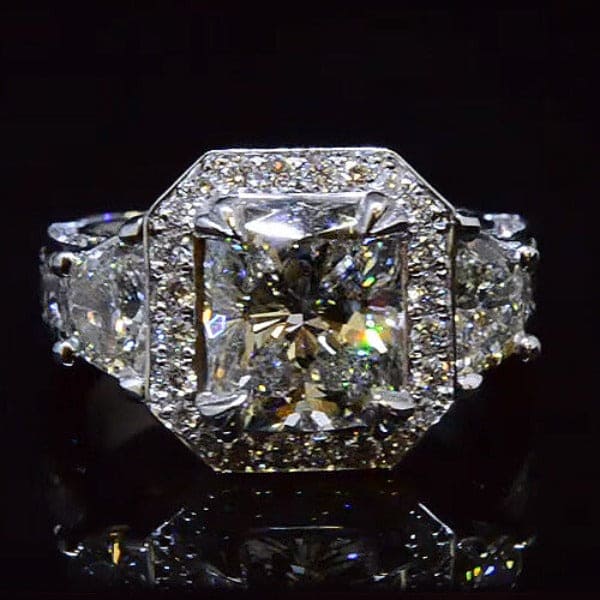 Halo cushion cut engagement ring with thick shank
