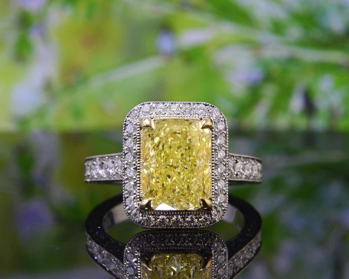 Halo radiant cut fancy yellow engagement ring front view