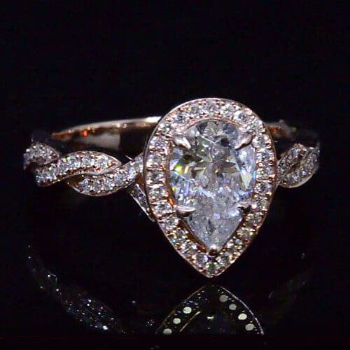 Pear cut diamond halo engagement ring