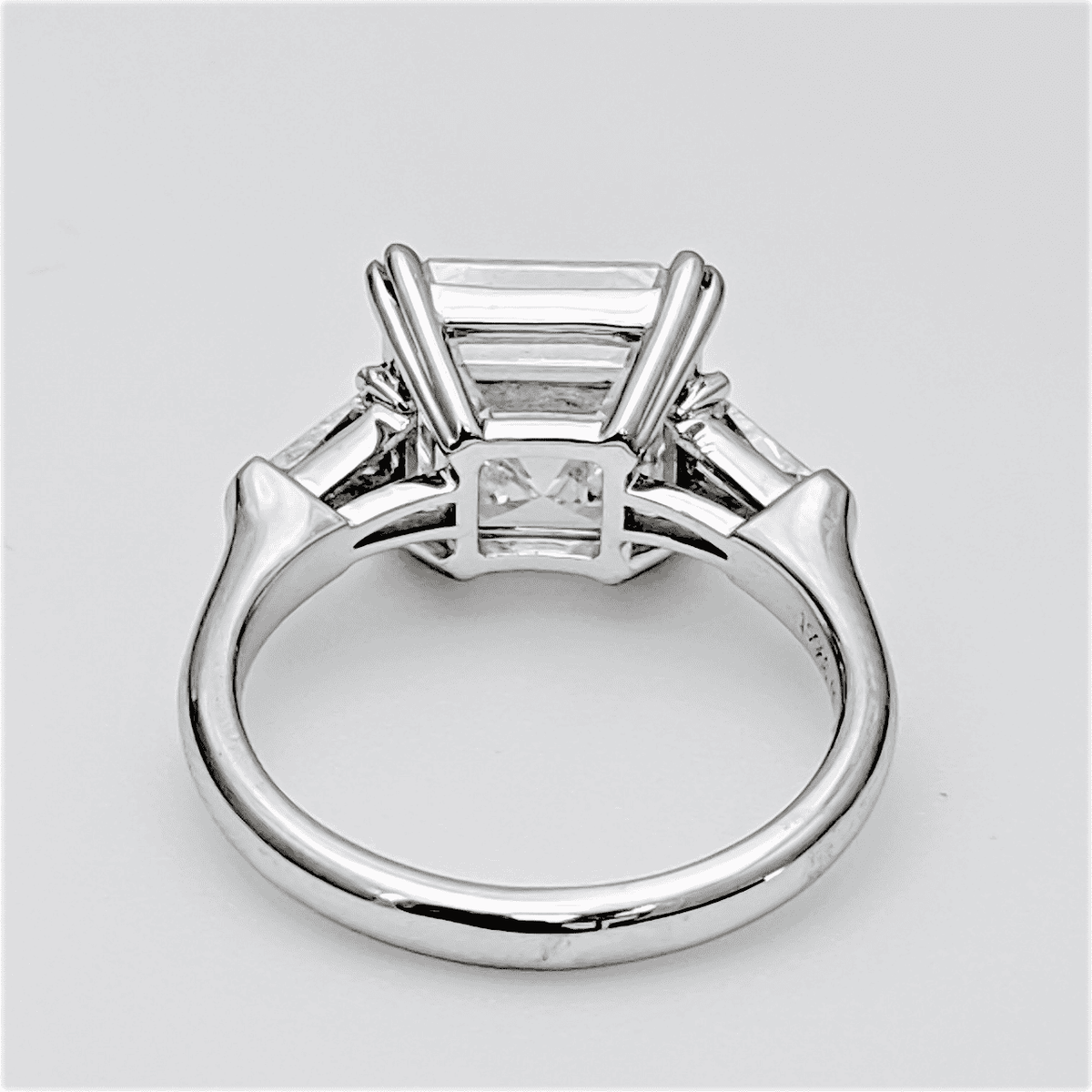 3 stone asscher cut engagement ring side view
