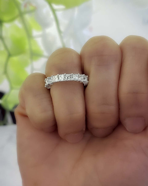 asscher cut eternity ring - view on a finger