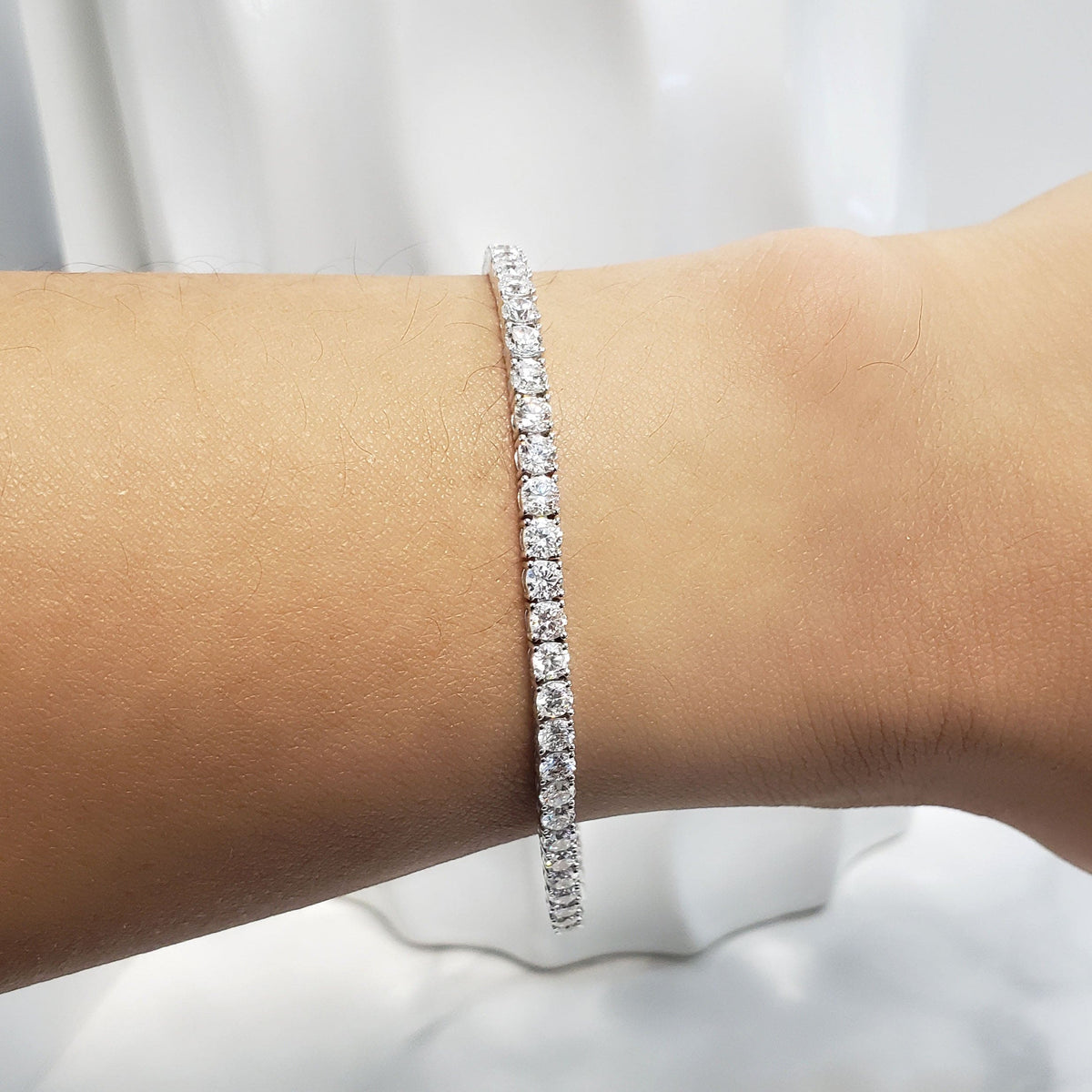 Tennis bracelet on hand