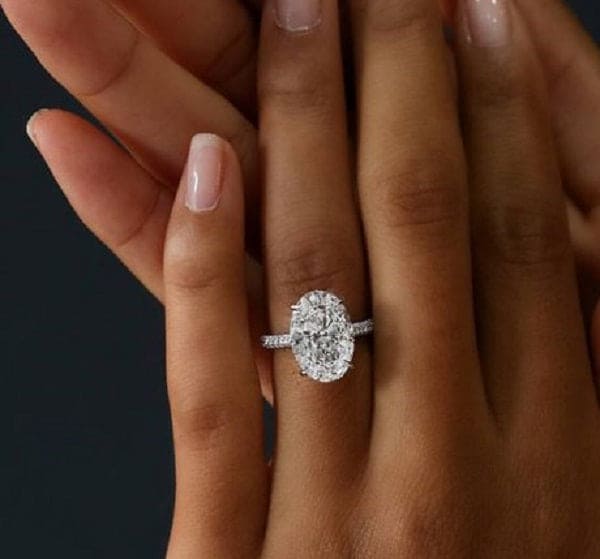Hidden halo oval engagement ring