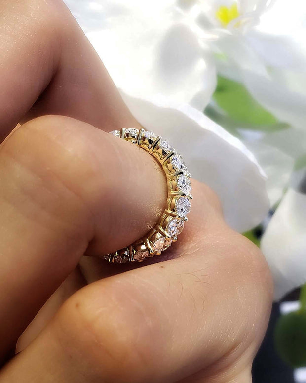 Oval cut natural diamond eternity ring yellow gold- view from side