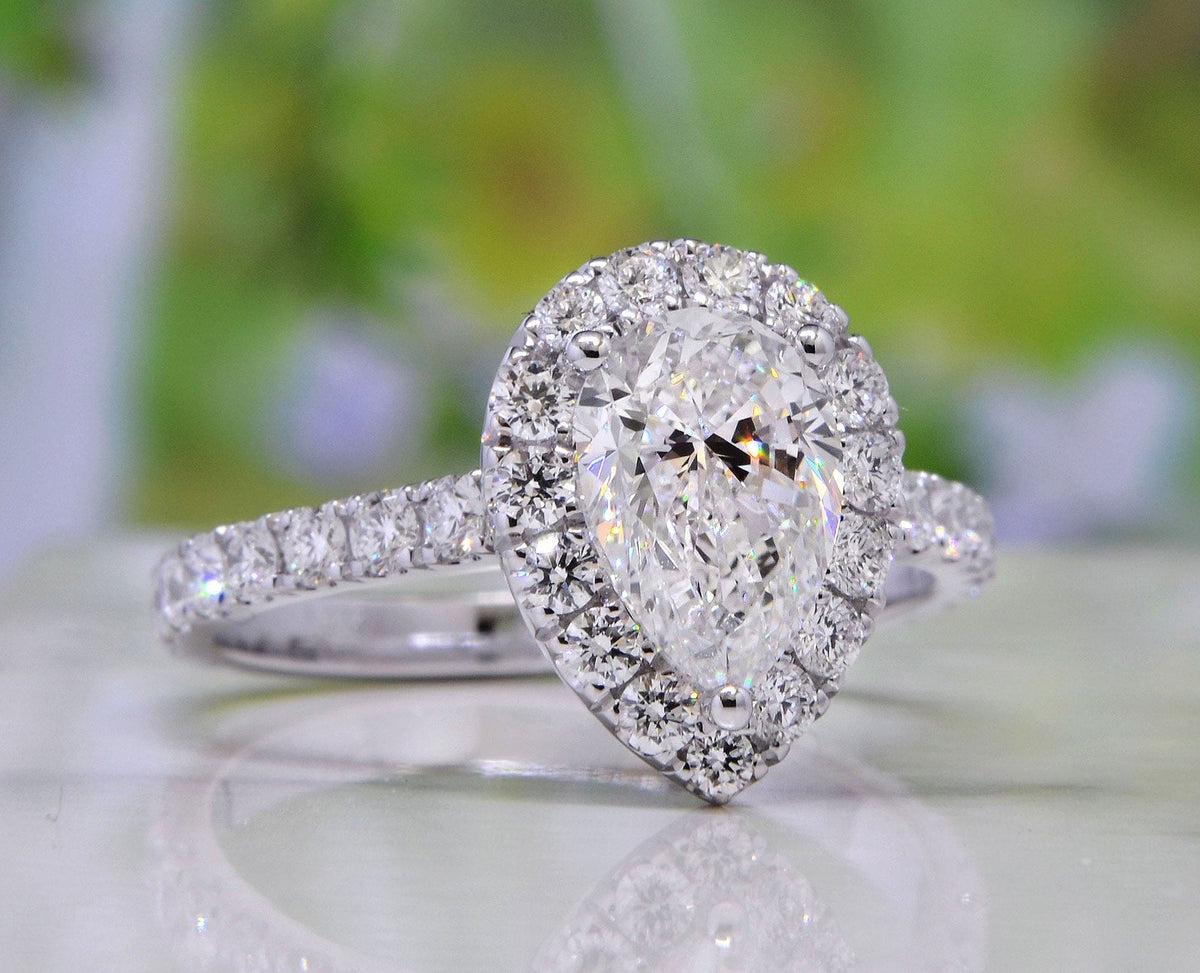 Halo teardrop pear cut engagement ring set