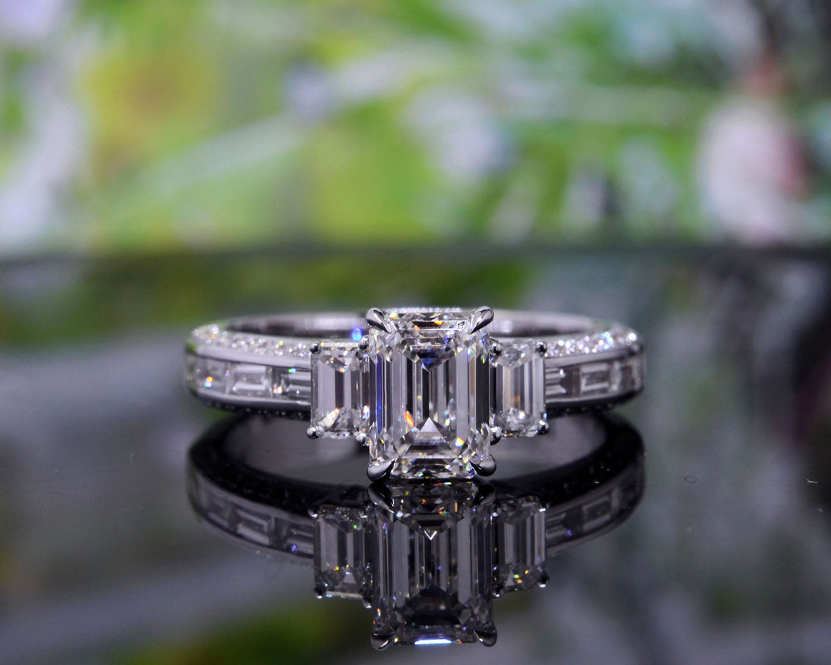  emerald cut 3 stone diamond ring 