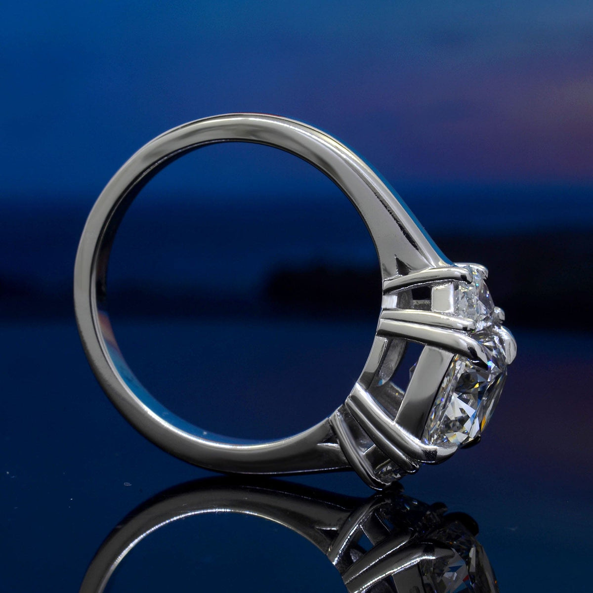 3 stone cushion cut ring with half moons side profile