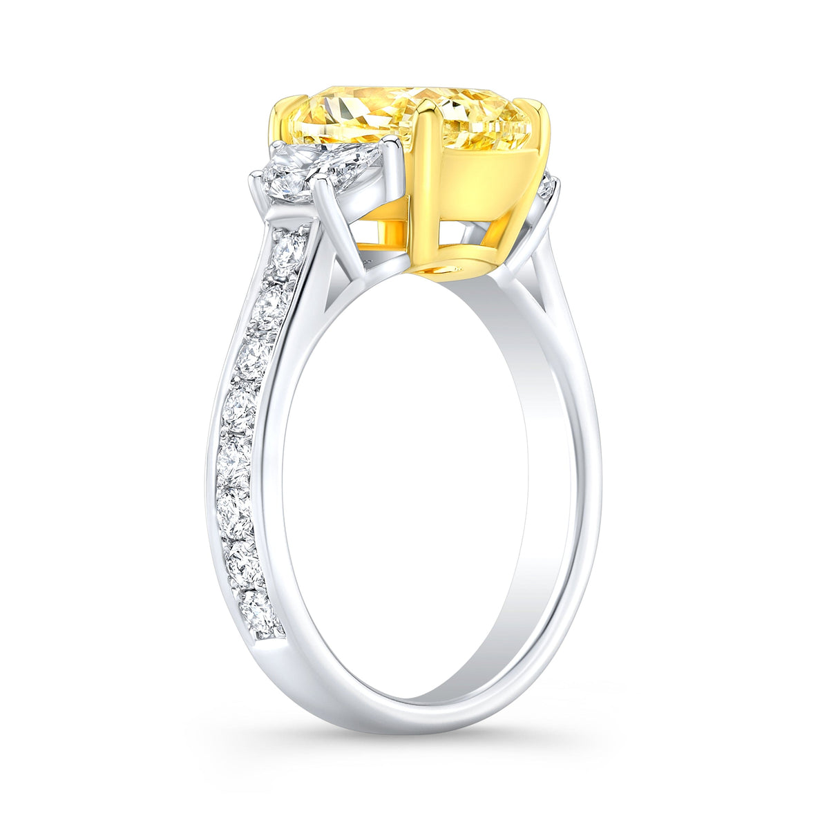 Intense yellow cushion 3 stone ring profile view