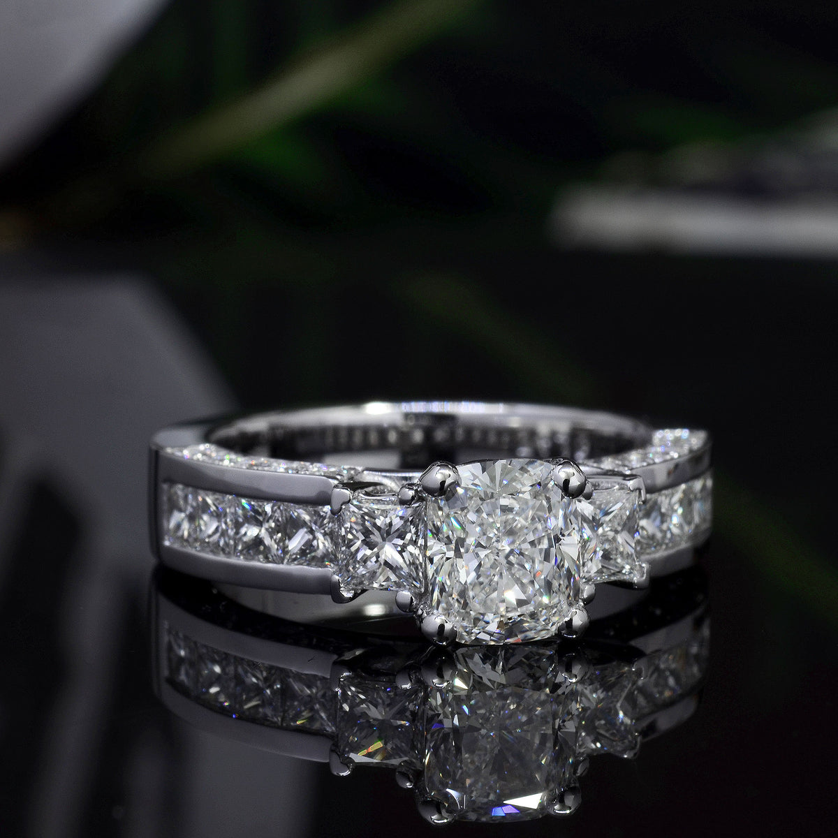 Cushion cut 3 stone engagement ring with accents