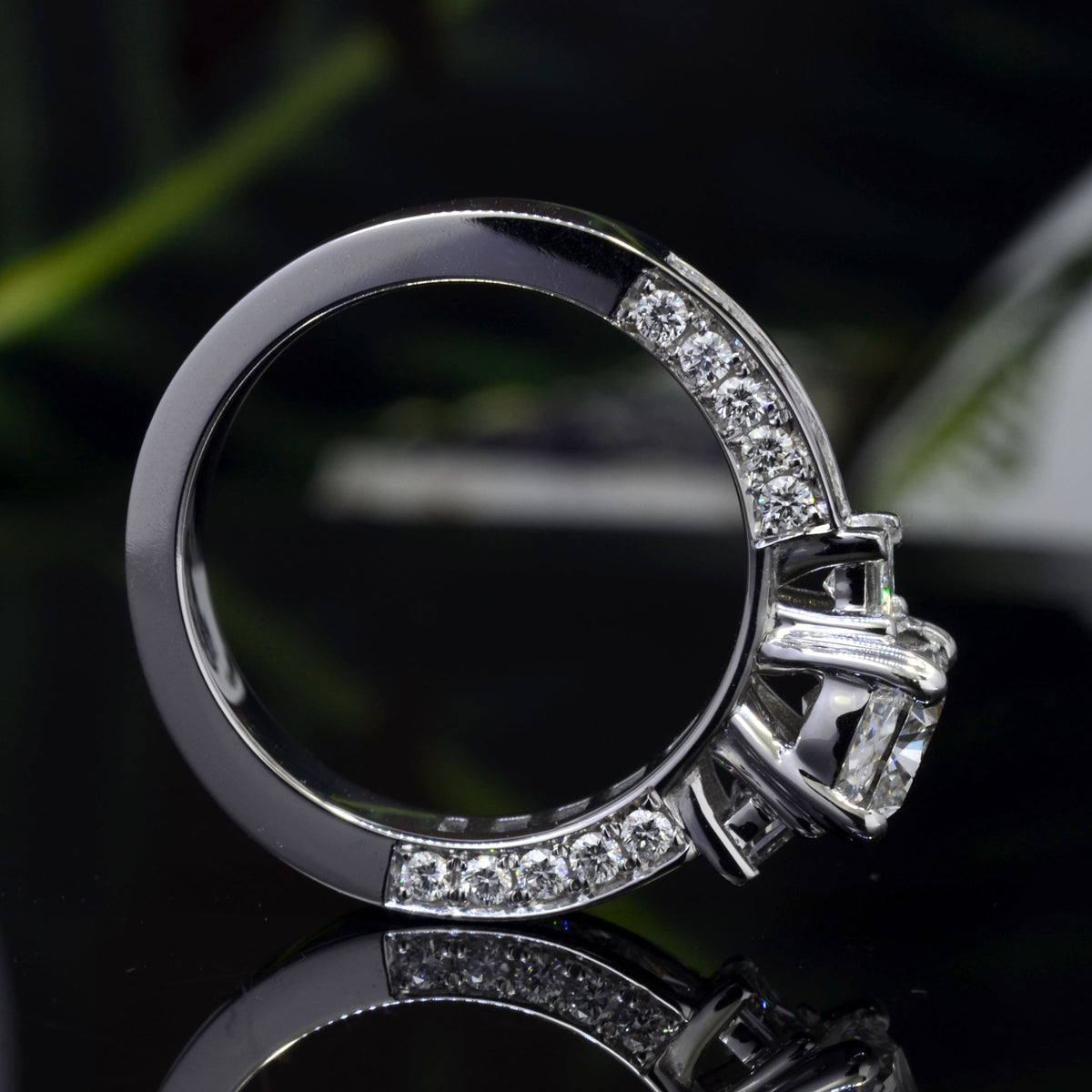 Cushion cut 3 stone engagement ring with accents side profile
