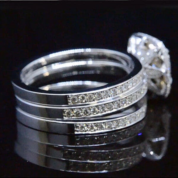 Cushion cut halo pave diamond ring set side view