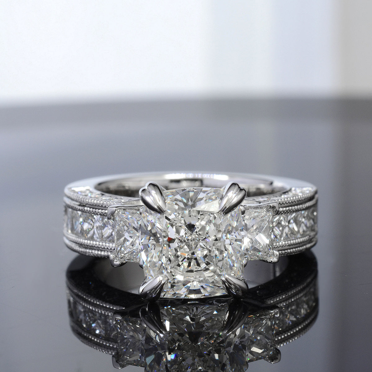 Cushion cut 3 stone diamond ring with accents