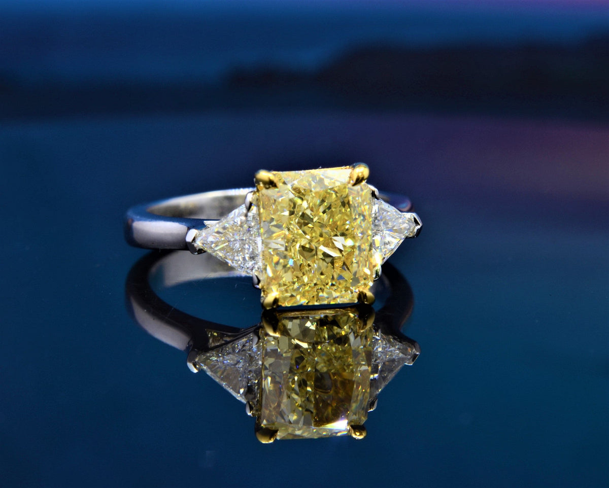 Elongated radiant fancy light yellow & trillions 3 stone ring