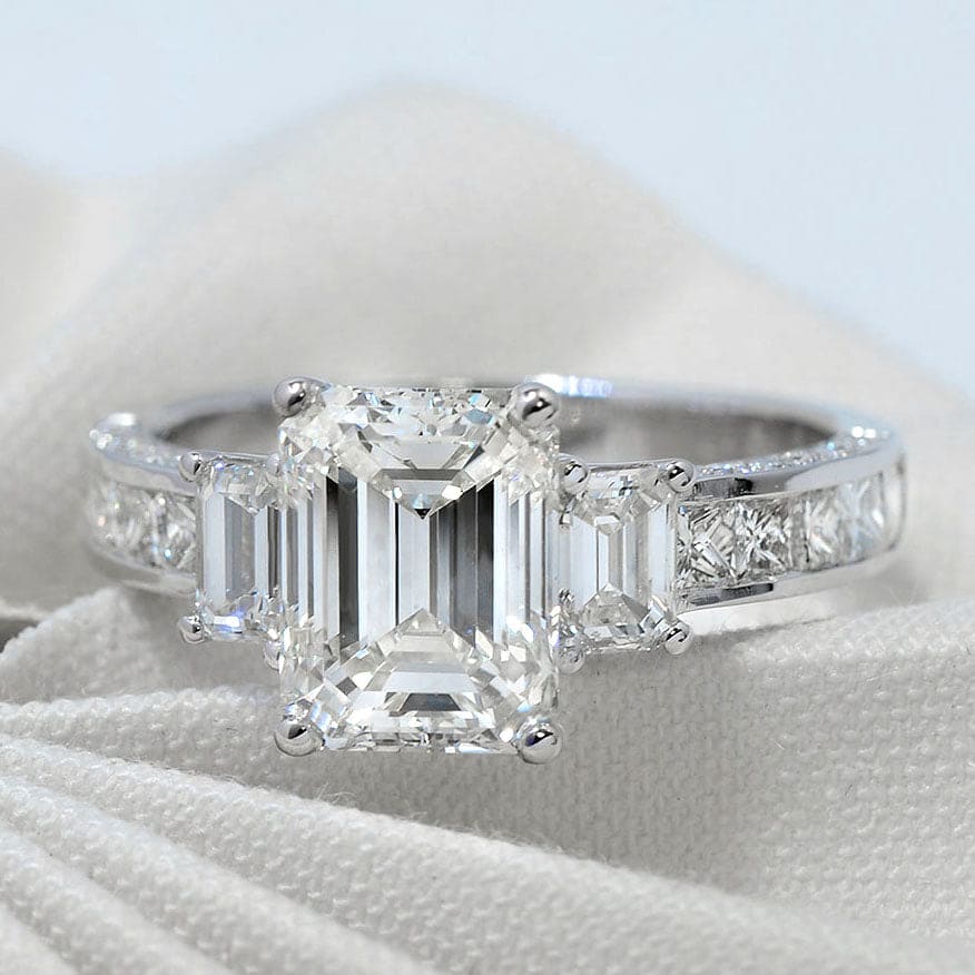 Royal emerald, princess, & baguette cut diamond ring 