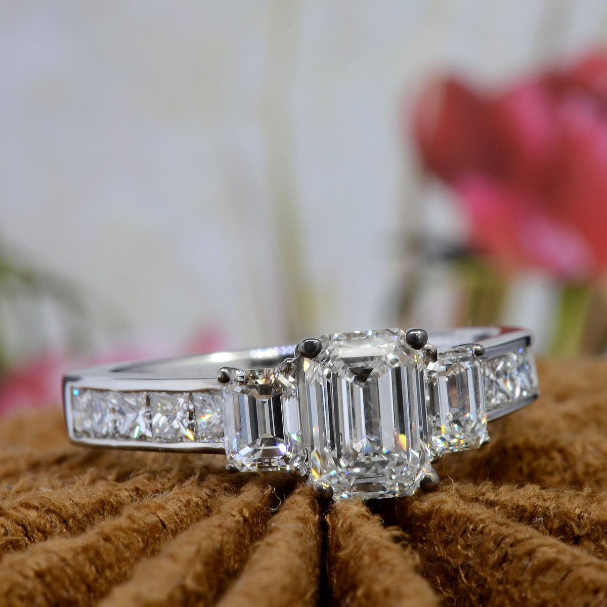 Emerald cut 3 stone diamond ring 