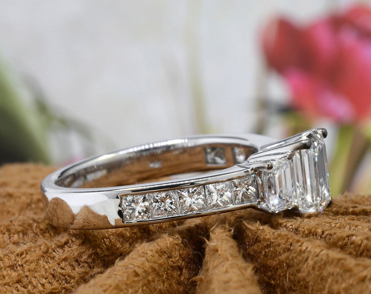 Emerald cut 3 stone diamond ring  side view