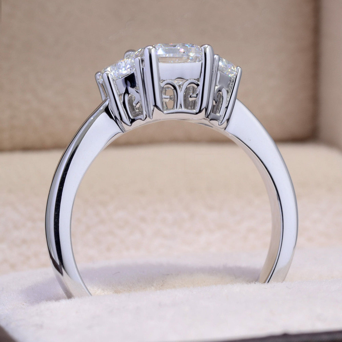 3 stone emerald cut& half moon diamond ring side profile