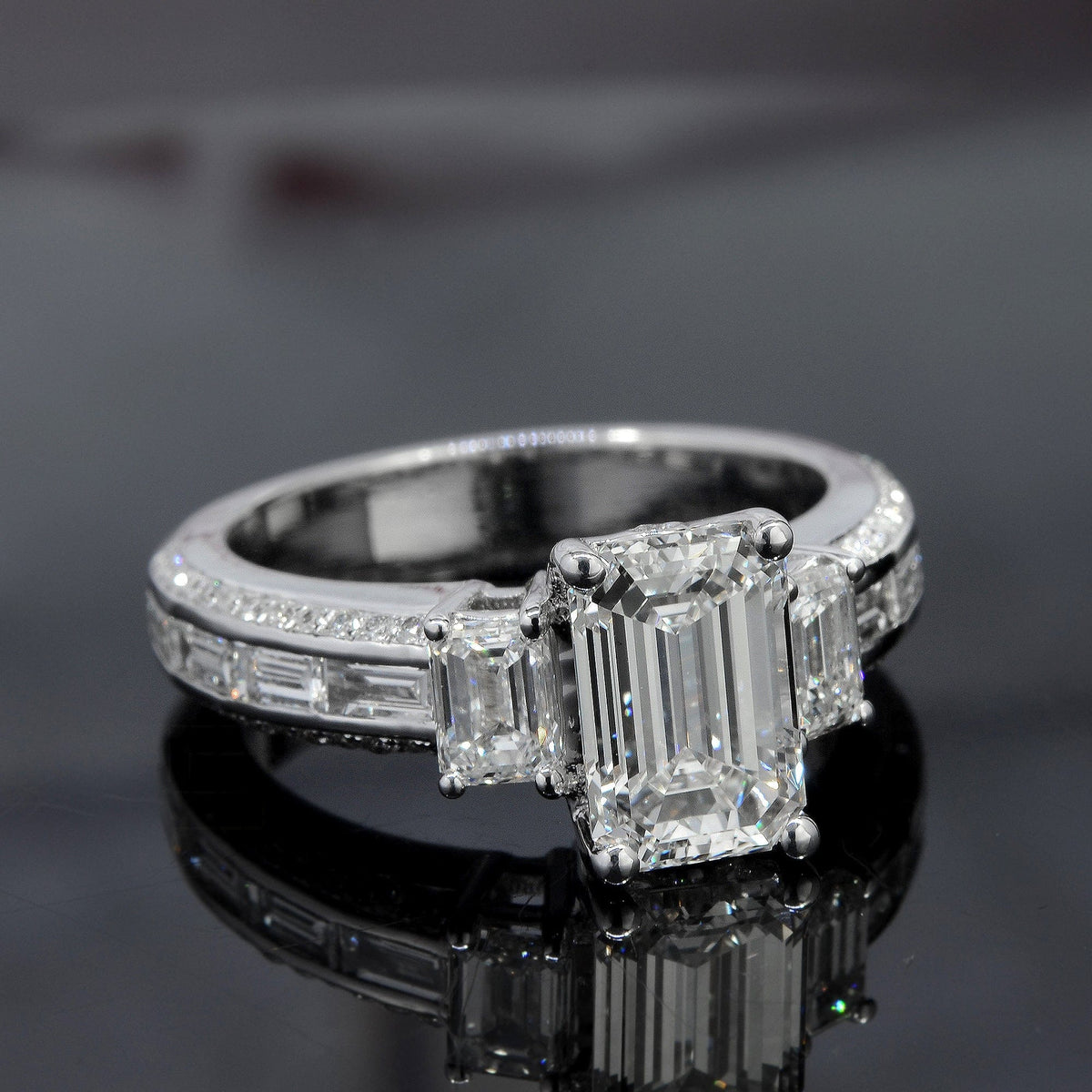 Emerald cut & baguette 3 stone engagement ring